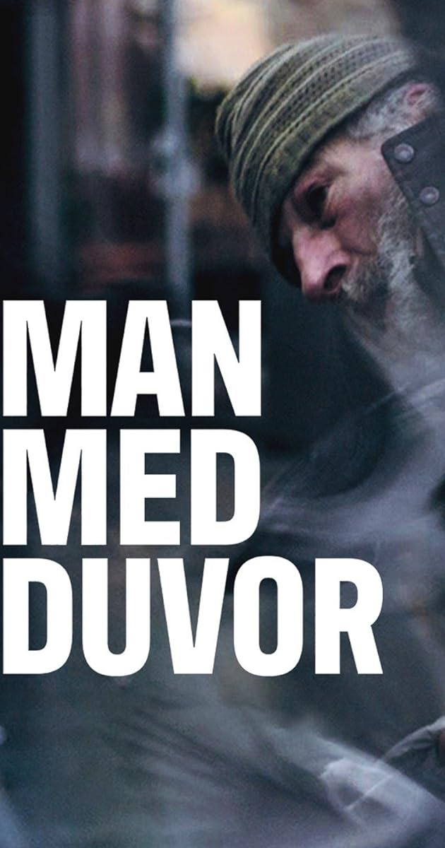 Man med duvor